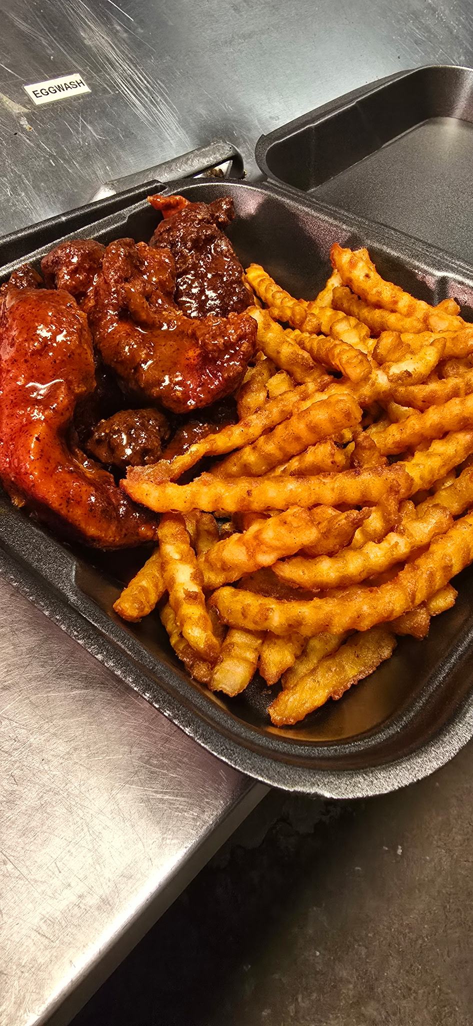 Hot fried chicken fingers with fries